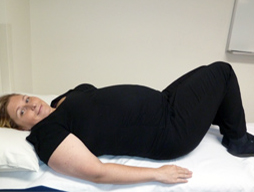 Woman lying on her back with her knees bent